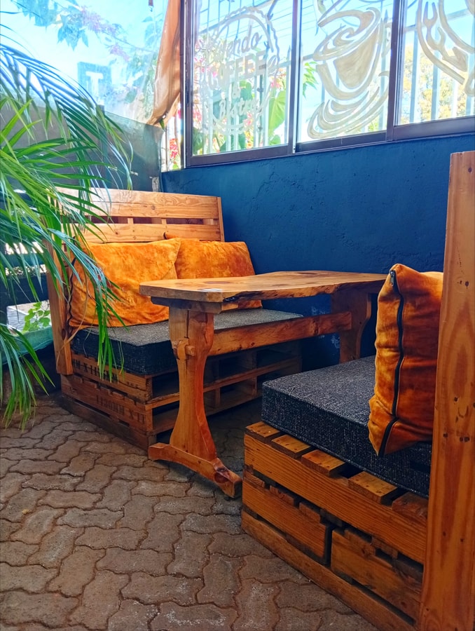 Unique wooden booth seating - King'ong'o Branch